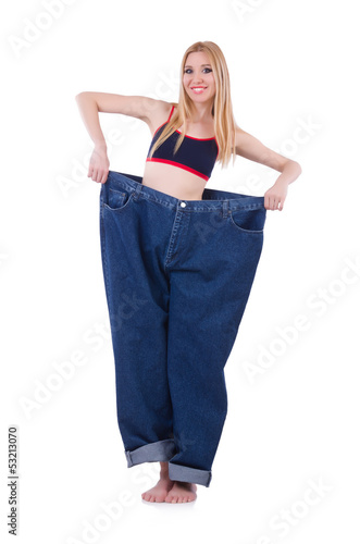 Photo: Dieting concept with oversize jeans Dieting concept with oversize jeans