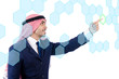 Photo: Arab man pressing virtual buttons Arab man pressing virtual buttons