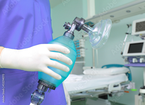 Photo: Doctor with breathing bag in a hospital. Doctor with breathing bag in a hospital.