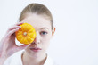 Young girl with a yellow pumpkin