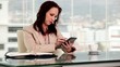 Serious businesswoman using a tablet