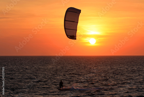 Photo: kitesurfer at sunset kitesurfer at sunset