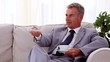 Video: Smiling businessman drinking a cup of tea Smiling businessman drinking a cup of tea