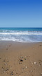 Beach, sea shore and blue sky vertical panorama.