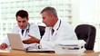 Video: Doctor showing and explaining something to his colleague Doctor showing and explaining something to his colleague
