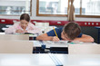 Boy And Girl Studying In Classroom