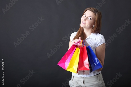 Photo: young woman with shopping bags young woman with shopping bags