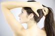 Woman holding long hair
