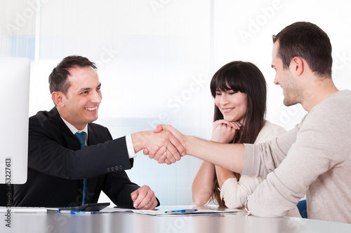 Photo: Consultant Shaking Hands With A Man Consultant Shaking Hands With A Man
