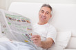 Mature Man Holding Newspaper