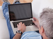 Mature Man Using Laptop