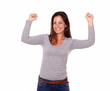 Happy female celebrating a victory smiling at you