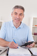 Happy Mature Man Calculating