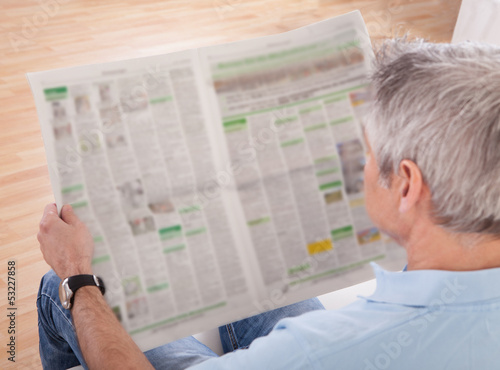 Photo: Mature Man Reading Newspaper Mature Man Reading Newspaper