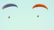 Paragliding over the mountains against clear blue sky