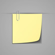 Sticky note clipped with a paperclip