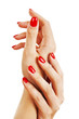 Hands of a young woman with long red manicure on nails