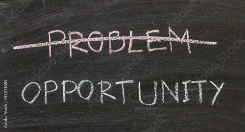 Photo: problems crossed out and opportunity on blackboard problems crossed out and opportunity on blackboard