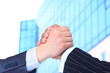 The conclusion of the transaction. Handshake.
