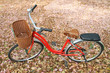 Red bicycle parked on the ground