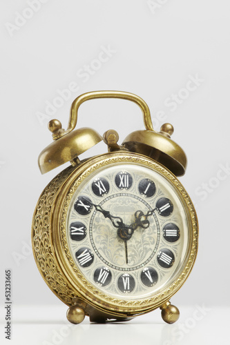 Photo: Old antique brass alarm clock Old antique brass alarm clock