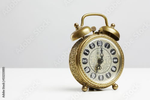 Photo: Old antique brass alarm clock Old antique brass alarm clock