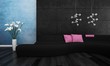 Modern black couch with pink pillows