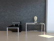 Modern black chair against dark wall with decoration