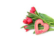 Bouquet of tulips and sugar heart on a white background