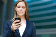 Businesswoman using her cell phone
