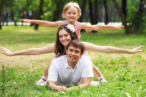Photo: happy family having fun outdoors happy family having fun outdoors