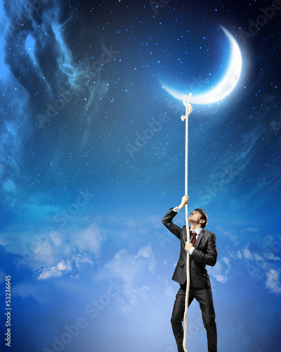 Photo: Image of businessman climbing rope Image of businessman climbing rope