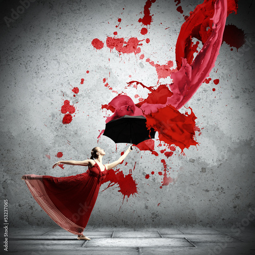 Photo: Ballet dancer in flying satin dress with umbrella Ballet dancer in flying satin dress with umbrella