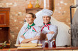 Foto: Portrait of two cooks with crossed arms Portrait of two cooks with crossed arms