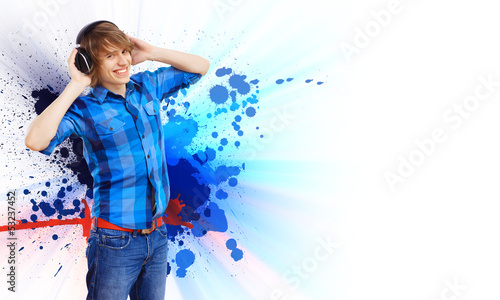 Photo: Happy smiling young man dancing Happy smiling young man dancing