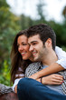 Couple in park embracing.