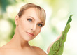 woman with green leaf