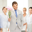 handsome man with flowers in hand