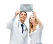 two doctors looking at x-ray
