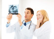 two doctors looking at x-ray