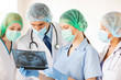 young group of doctors looking at x-ray