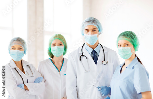 Photo: group of doctors in operating room group of doctors in operating room