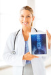 female doctor with x-ray on tablet pc