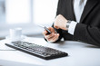 Foto: man hands with keyboard, smartphone and wristwatch man hands with keyboard, smartphone and wristwatch