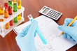 Photo: Hand scientist writing formulas Hand scientist writing formulas