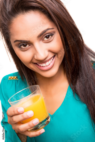 Photo: Beautiful mix race woman drinking juice Beautiful mix race woman drinking juice