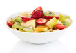 Useful fruit salad of fresh fruits and berries in bowl isolated
