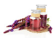 Medicine bottles with salvia flowers, isolated on white