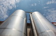 Foto: Silver silos - industrial infrastructure in wide lens Silver silos - industrial infrastructure in wide lens