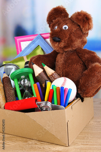 Photo: Personal property in carton on table in room Personal property in carton on table in room